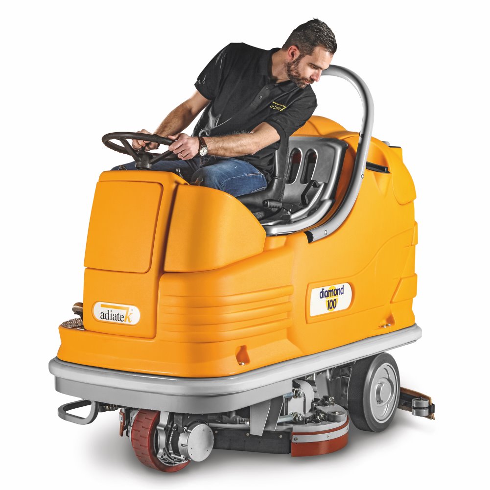 Person operating a yellow Adiatek Diamond 100p AC floor cleaning machine on a white background