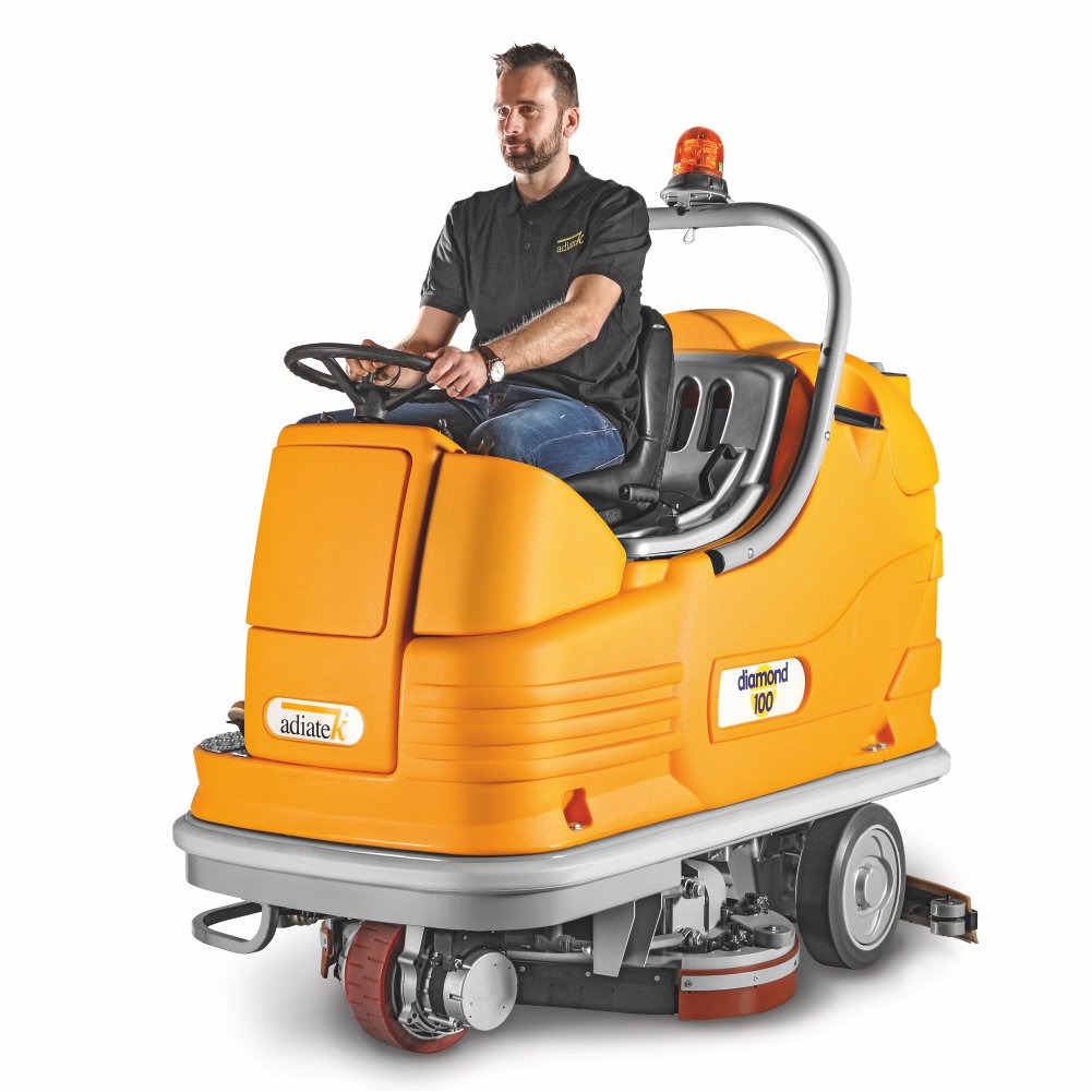 Man operating an Adiatek Diamond 100p AC floor cleaning machine with on a white background