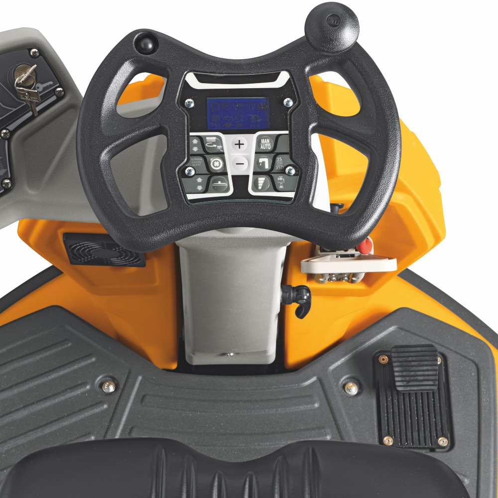 Control panel with steering wheel and digital display on a yellow and black Adiatek Topaz 90 Ride On Auto Scrubber machine.