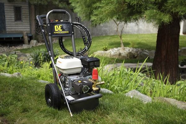 Bar Honda Pressure Cleaner 2700psi on grass with a tree and house in the background