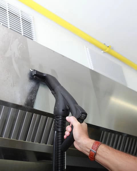 Person cleaning a metallic surface with a Novaltec Black Hawk Virucide.