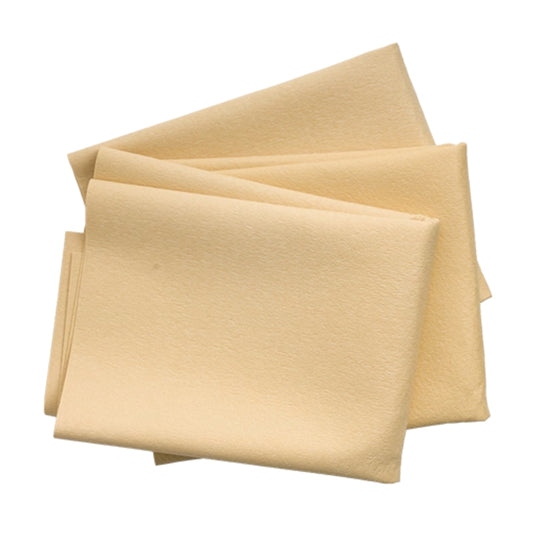 Folded beige cloths on a white background