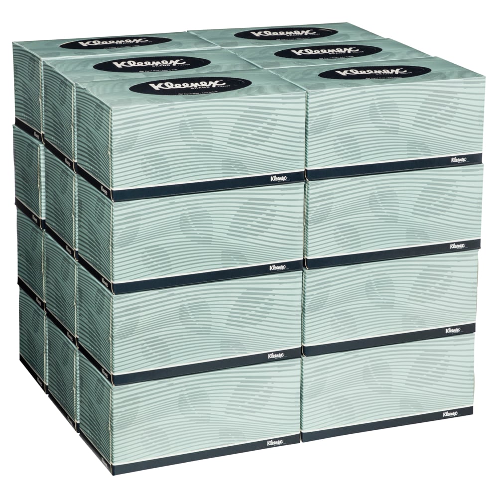 Stack of Kleenex facial tissue boxes on a white background