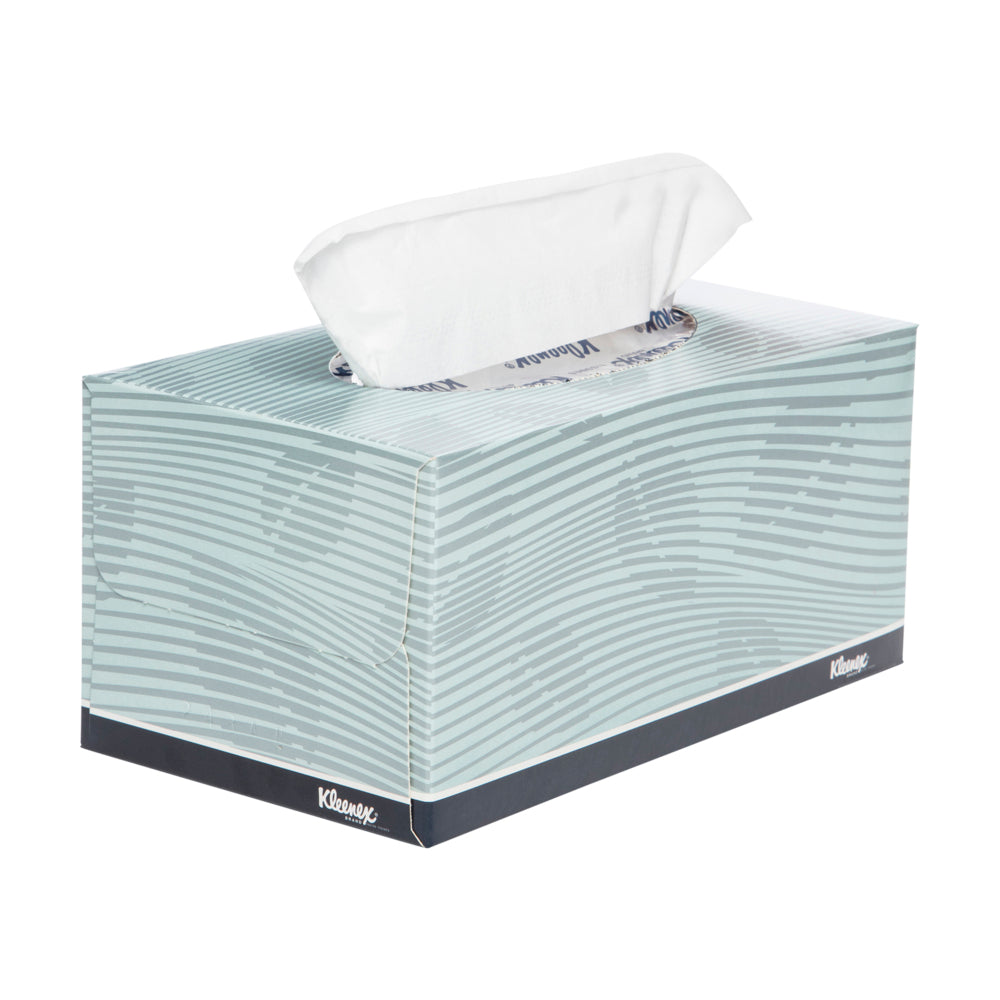 Kleenex tissue box with tissues peeking out on a white background
