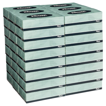 Stack of Kleenex facial tissue boxes on a white background
