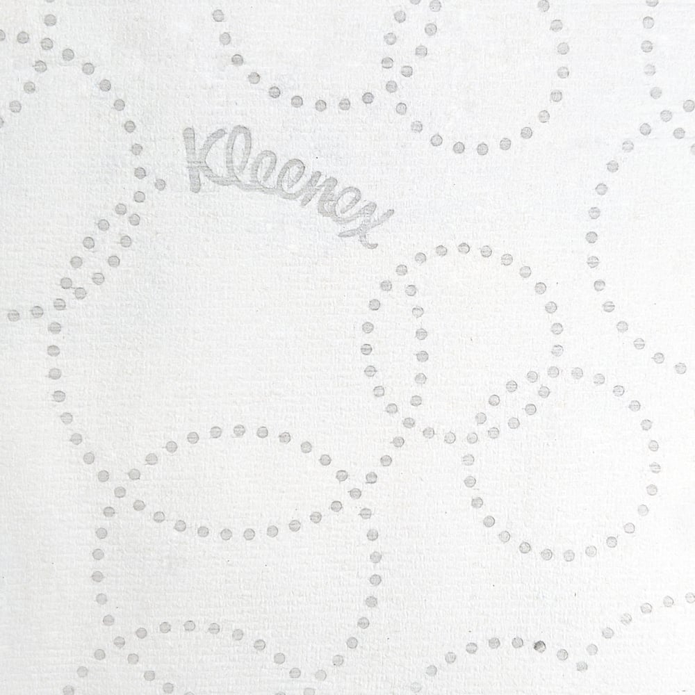 White paper with a subtle pattern of small dots and the brand name 'Kleenex' printed in the center.
