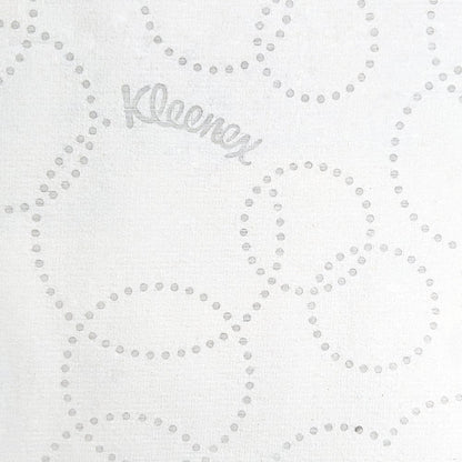 White paper with a subtle pattern of small dots and the brand name 'Kleenex' printed in the center.