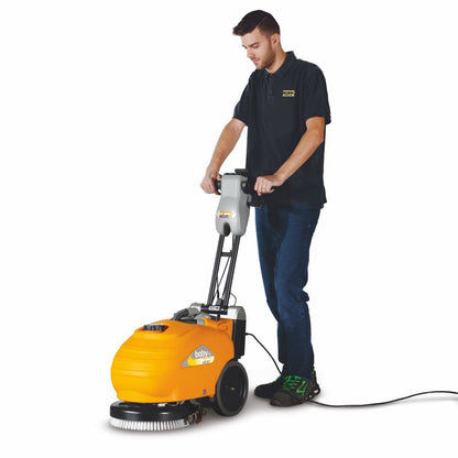 Person using a Adiatek Baby-e 33cm Floor Scrubber Corded machine on a white background