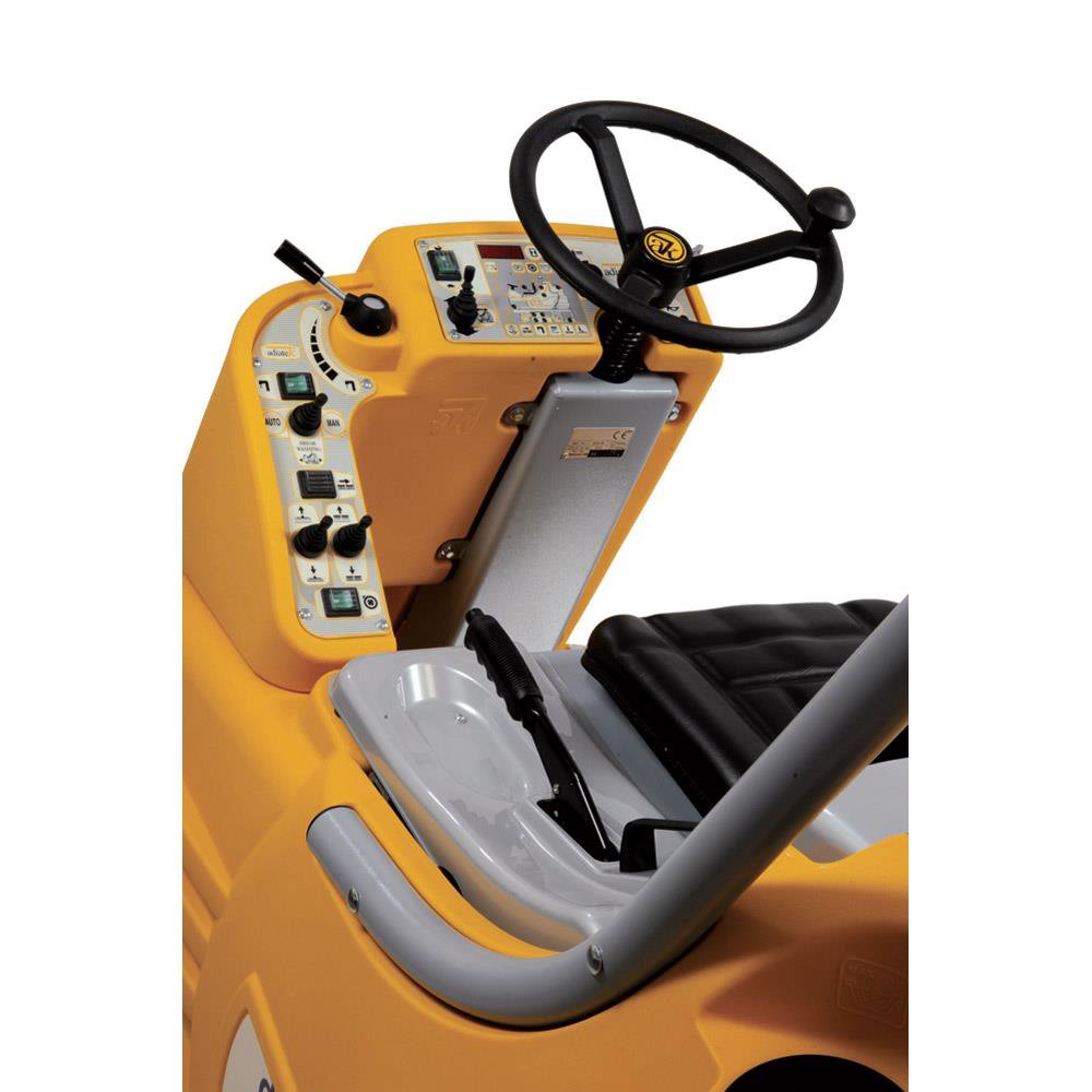 Close-up of a yellow Adiatek Diamond 100p AC seat with steering wheel and controls on a white background