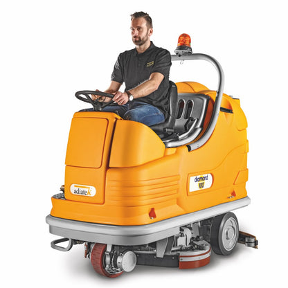 Man operating an Adiatek Diamond 100p AC floor cleaning machine with on a white background
