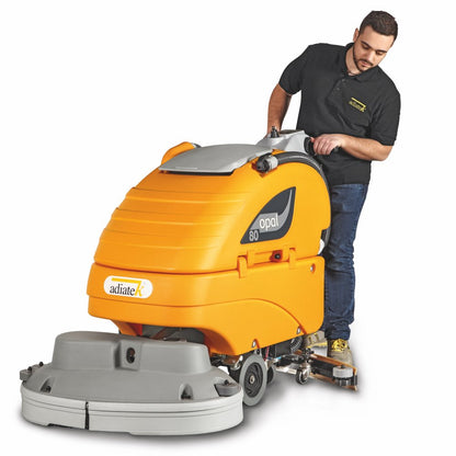 Person operating a Adiatek Opal 80 Auto Scrubber cleaning machine on a white background