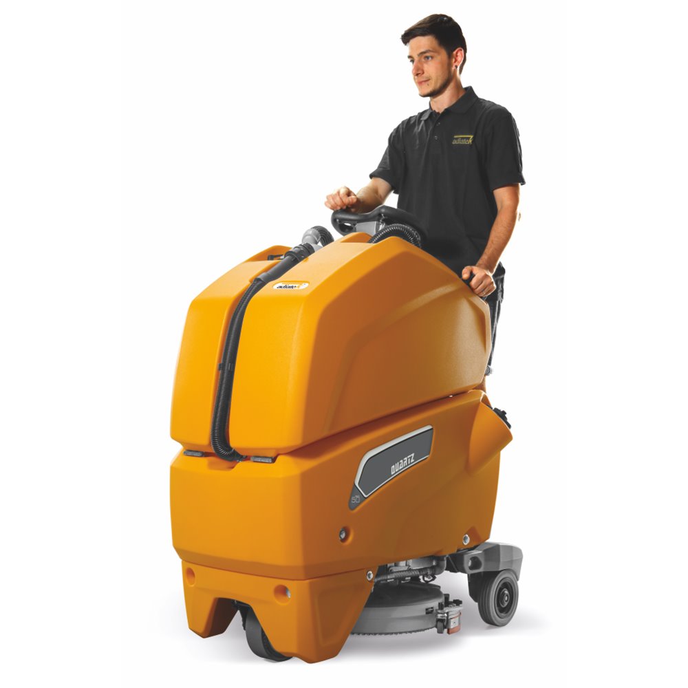 Person operating a large orange Adiatek Quartz 50 cleaning machine on a white background