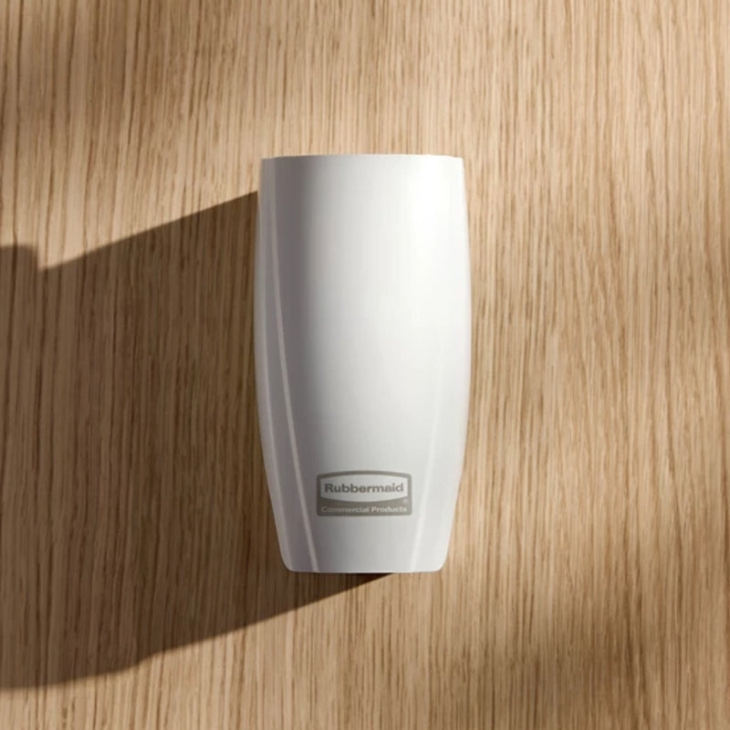 White air freshener dispenser on a wooden surface
