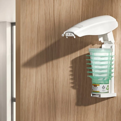 Handheld spray bottle with green container attached to a wooden surface