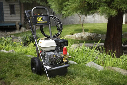 Bar Honda Pressure Cleaner 2700psi on grass with a tree and house in the background