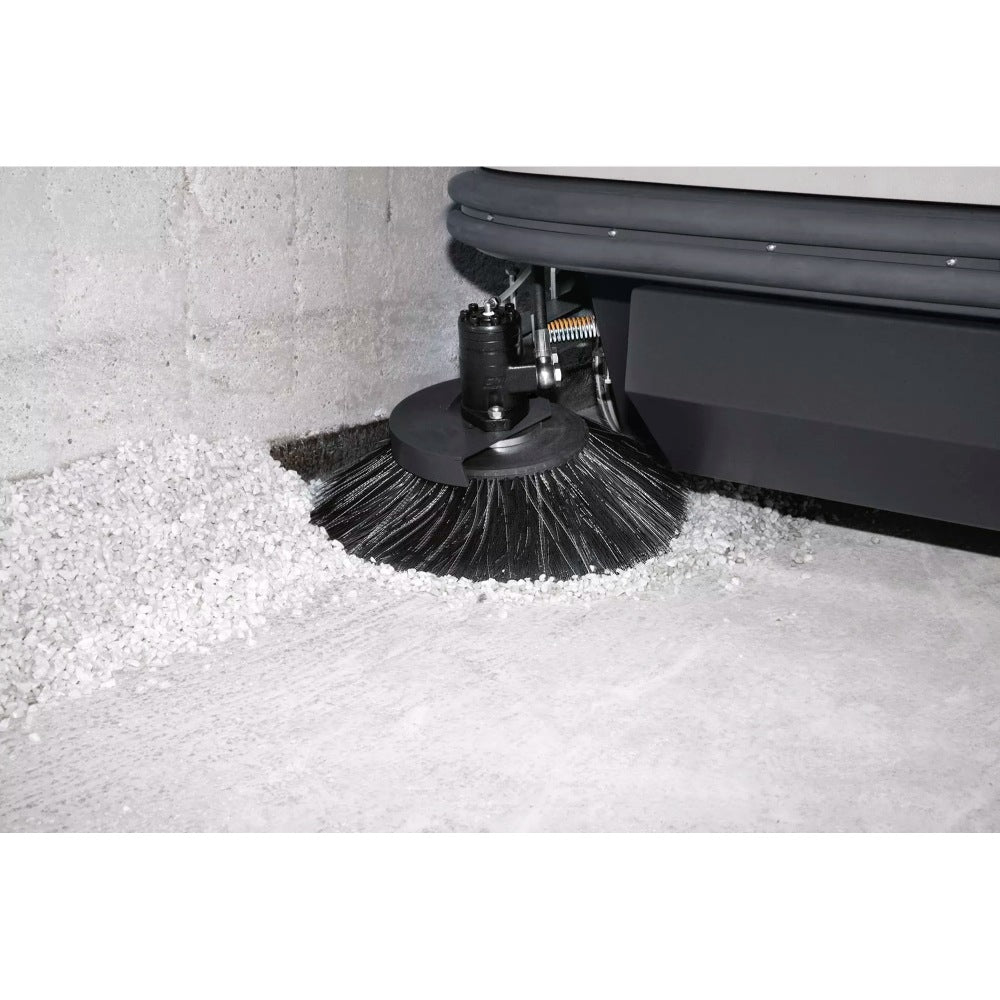 Close-up of a Comac CS120B Ride On Sweeper cleaning brush
