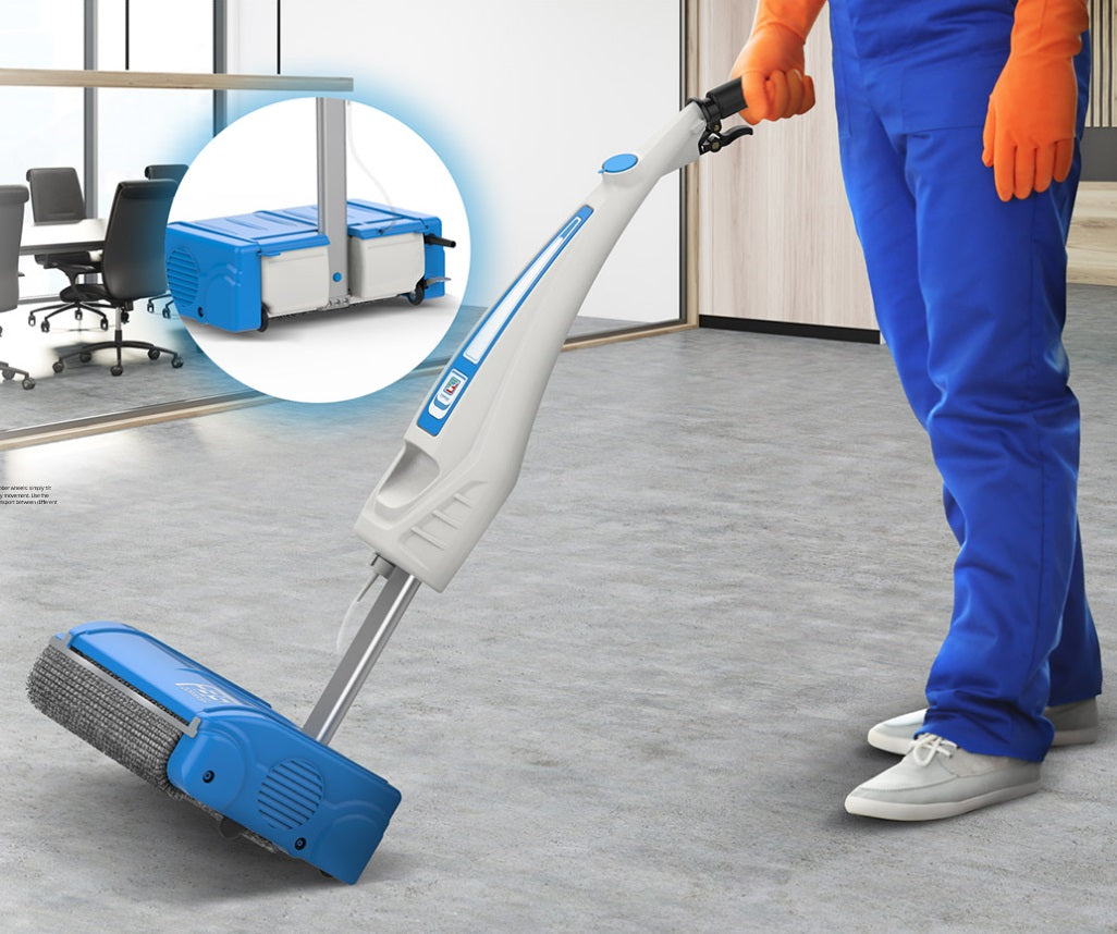 Person cleaning a floor with a blue and white cleaning tool in an office setting.