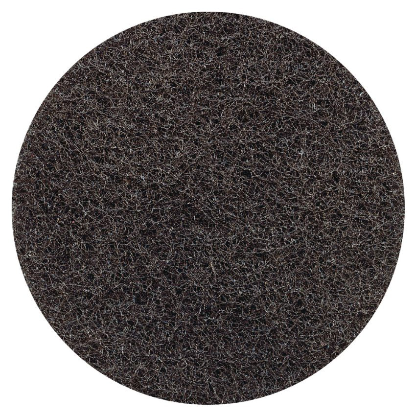 Round black stripping pad on a white background