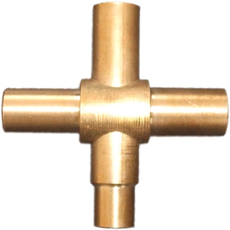 Brass T-shaped fitting on a white background