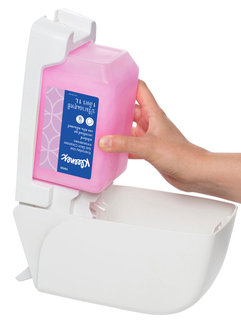 Hand holding a pink container with a white dispenser on a white background