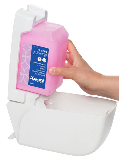 Hand holding a pink container with a white dispenser on a white background