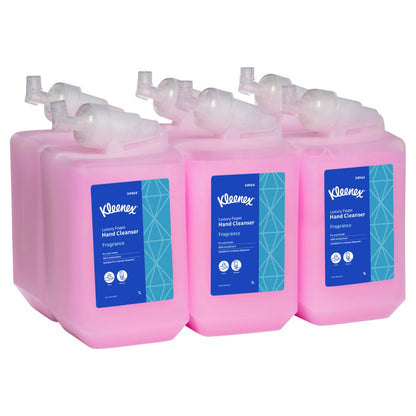 Six pink bottles of Kleenex hand cleaner with blue labels on a white background