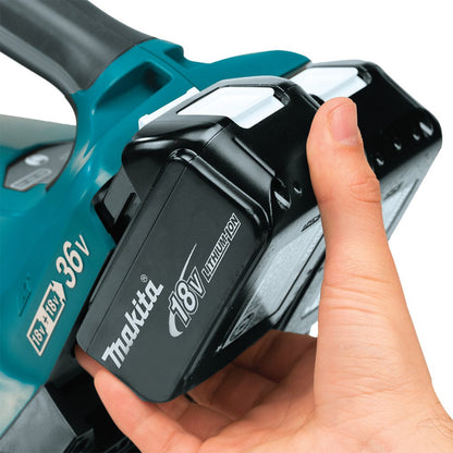 Hand holding a Makita Makita Turbo Leaf Blower with battery attached on a white background