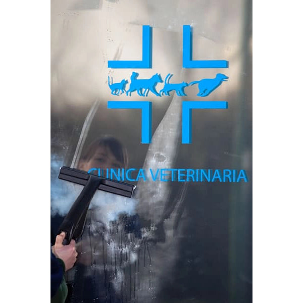 Person cleaning metal sign with a Novaltec Black Hawk R Steam Generator