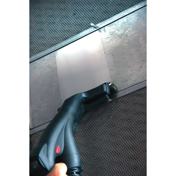 Handheld Novaltec Black Hawk R Steam Generator being used on a piece of metal trim
