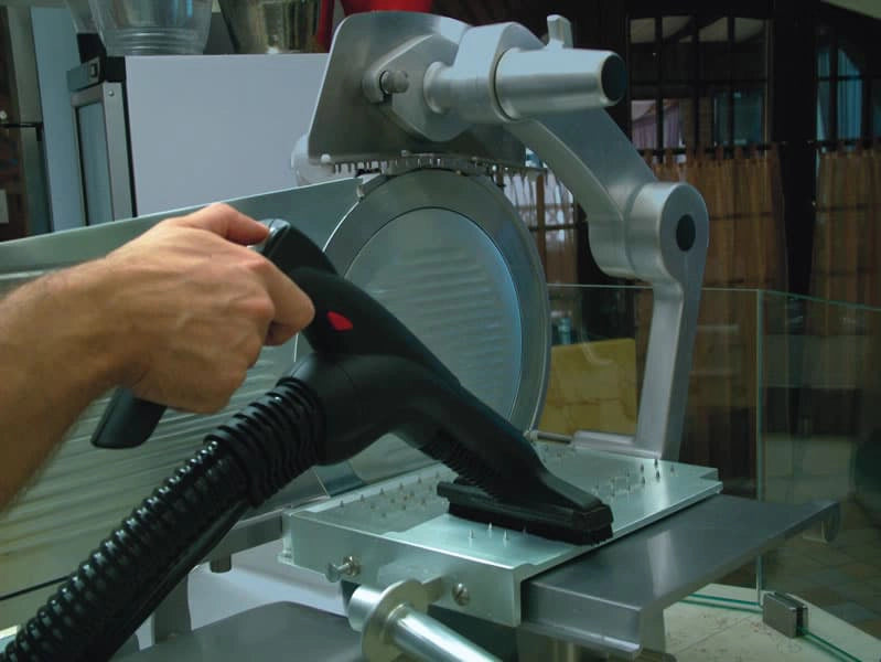 Person using a Novaltec Black Hawk Virucide on a metal equipment