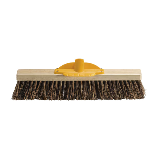 Brush with wooden handle and black bristles on a white background