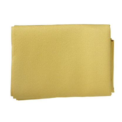 Folded yellow fabric cloth on a white background