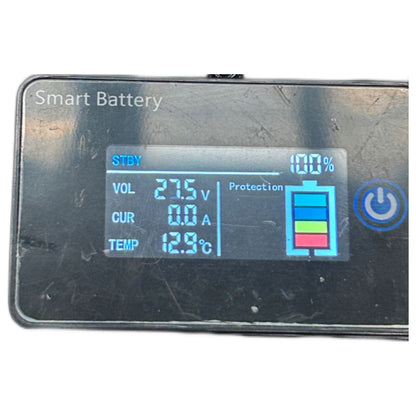 Smart battery monitor with digital display on a white background