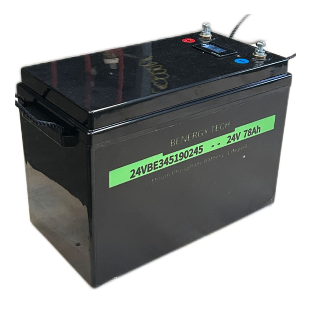 Black battery with green label on a white background
