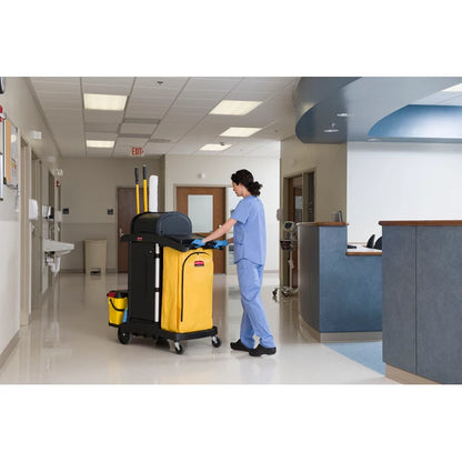 Person pushing a Rubbermaid High Security Cleaning Cart with supplies in a hospital setting