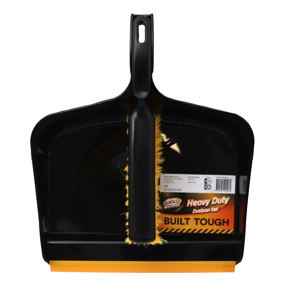 Black dustpan with yellow accents and a visible label on a white background