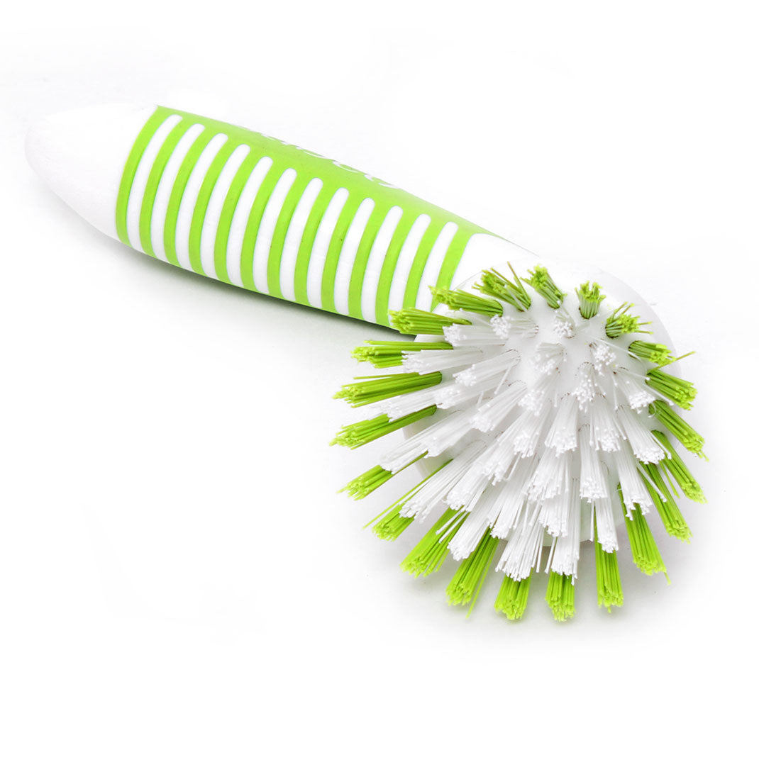 Cleaning brush with green and white striped handle on a white background