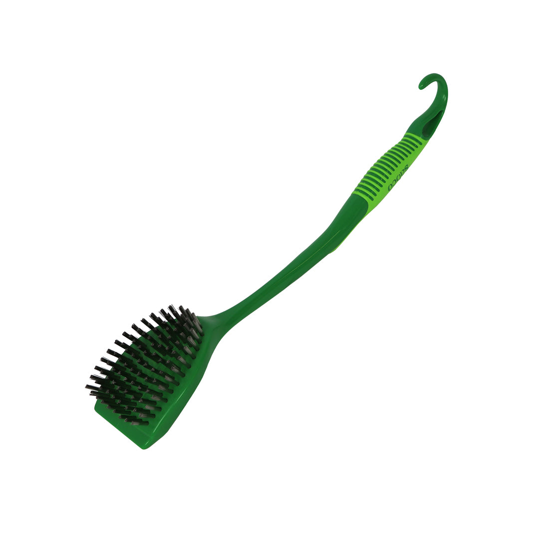 Green grill brush with a long handle on a white background