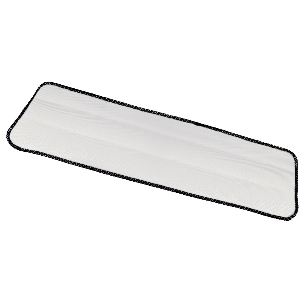 Rectangular white cleaning pad with black border on a white background