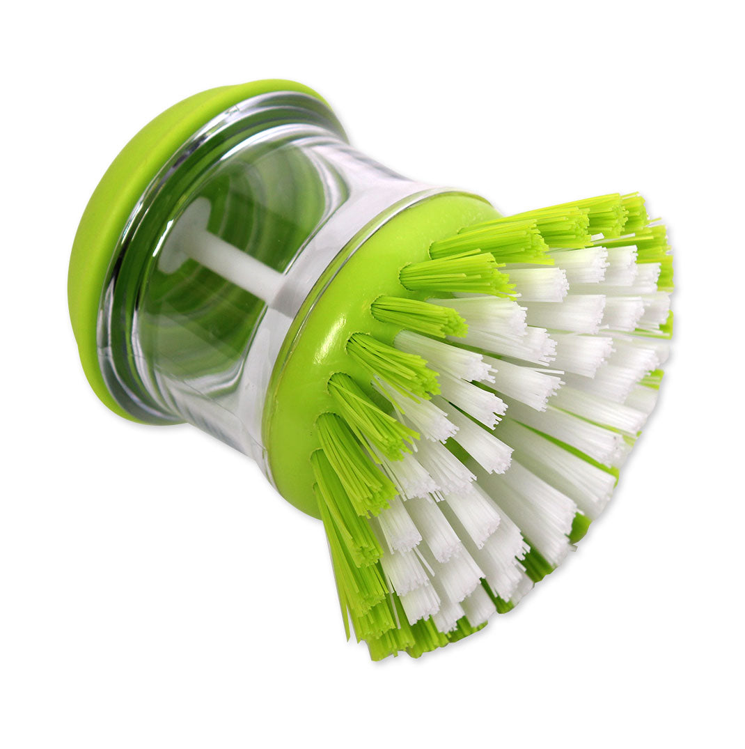 Green kitchen brush with bristles on a white background