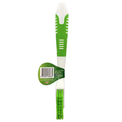 Green and white cleaning brush with a label on a white background