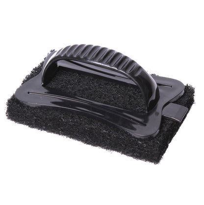 Black scrubber with textured handle on a white background