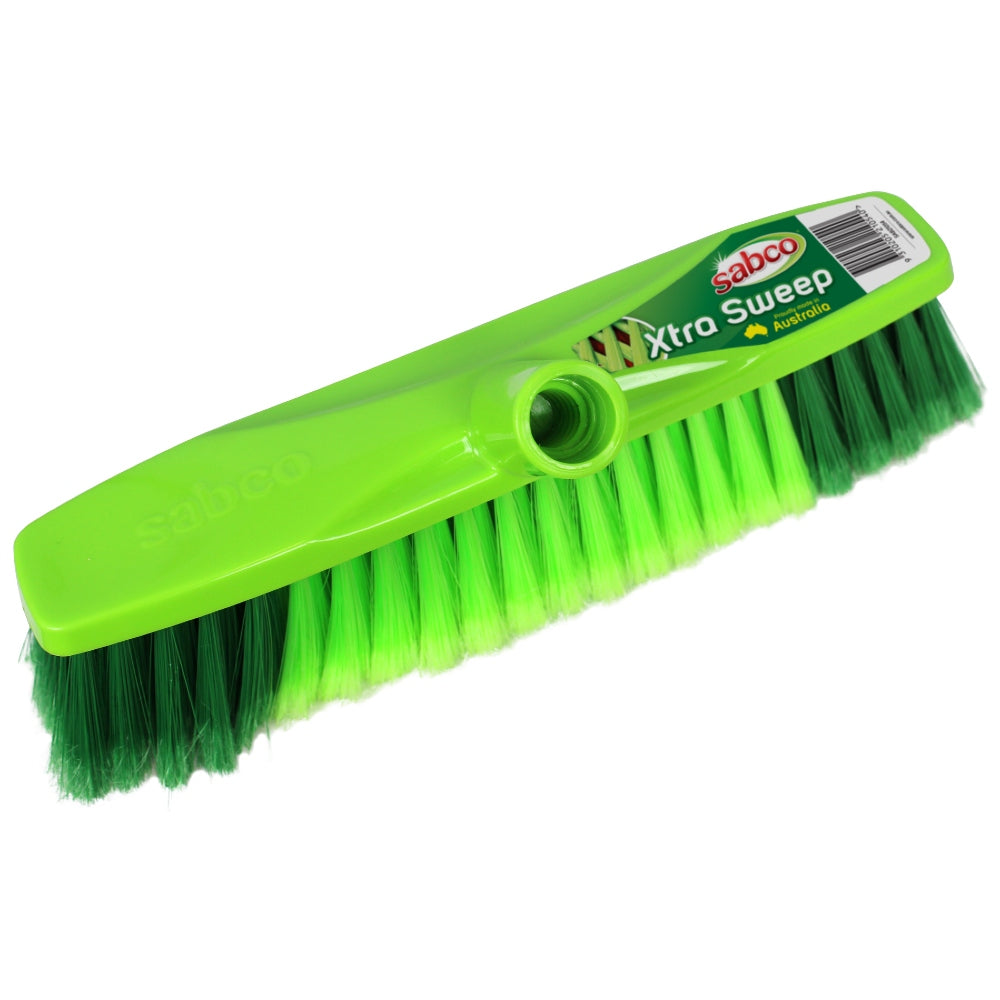 Green broom with green bristles on a white background