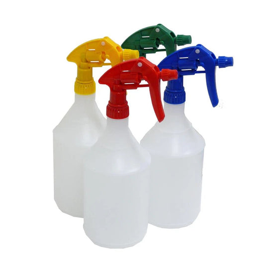 Four spray bottles with colorful nozzles on a white background
