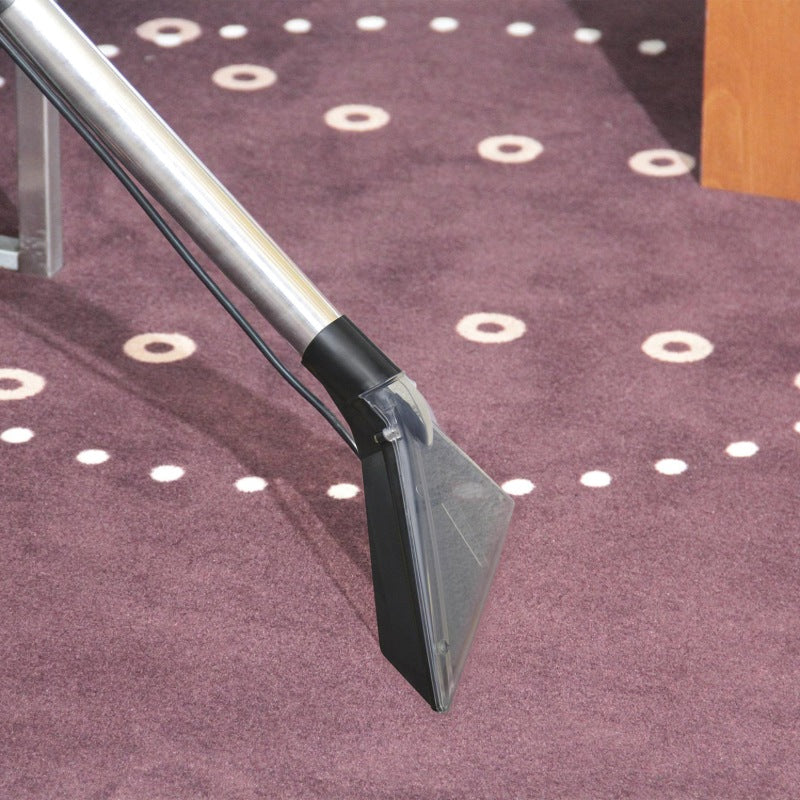 Carpet cleaning tool on a purple carpet with white circular patterns