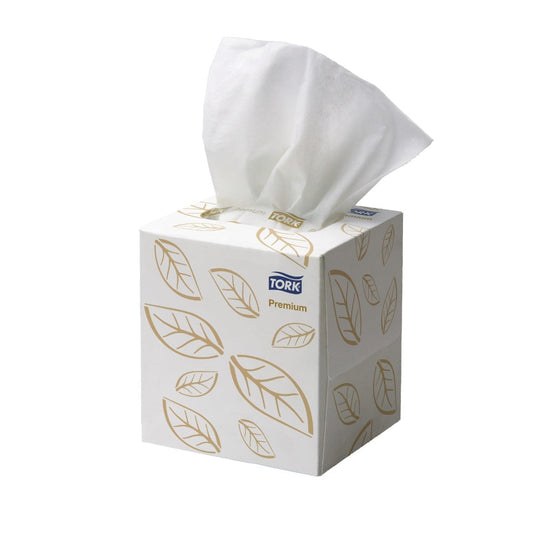 Tork tissue box with tissues peeking out on a white background