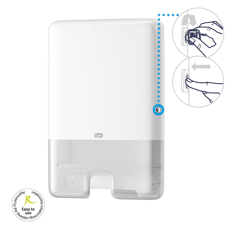 Tork paper towel dispenser with key instructions on a white background