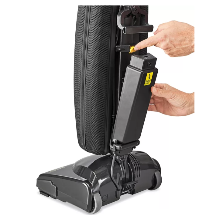 Person using a Tornado Roam Upright Vacuum Cleaner attachment on a white background