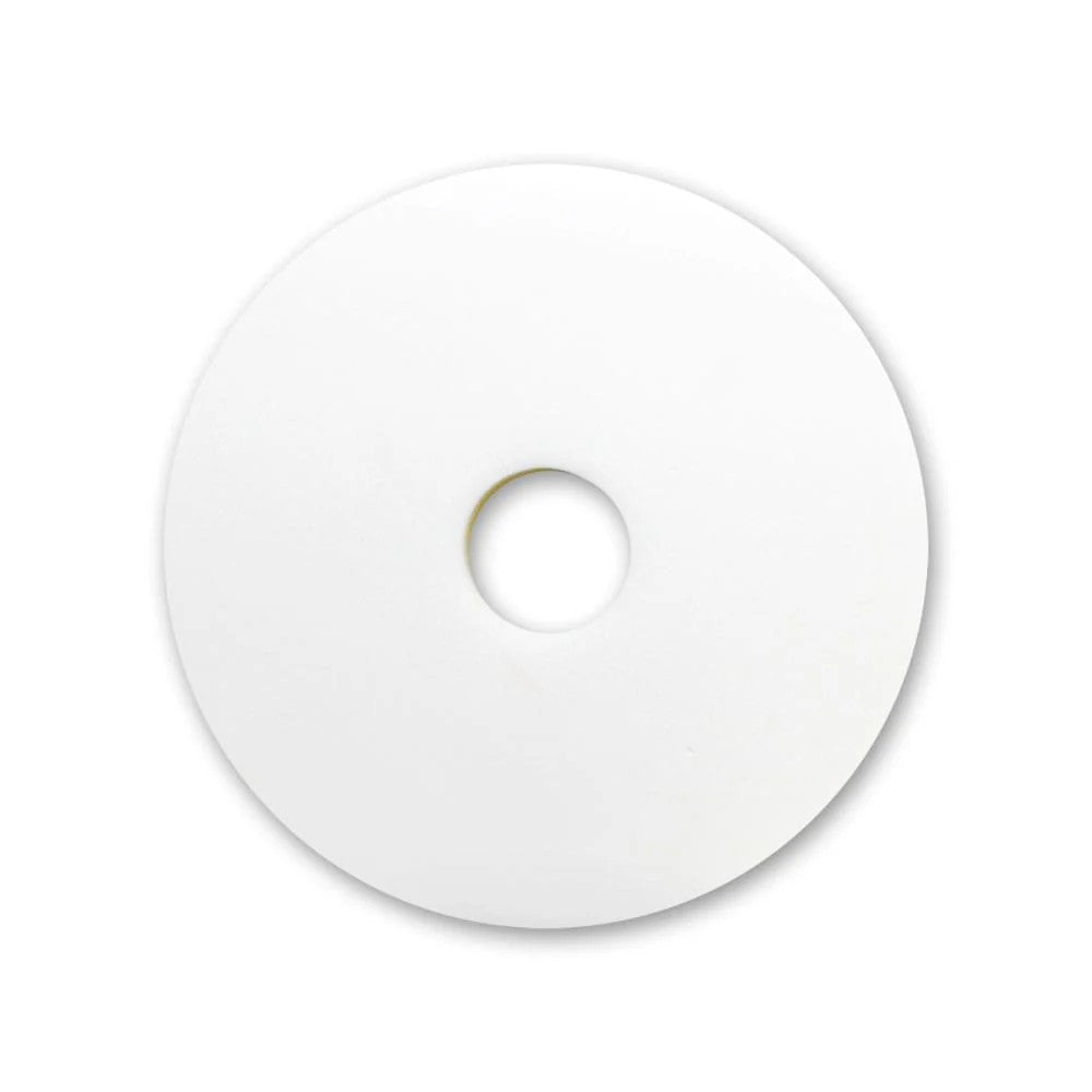 White Magic Sponge Floor Pad with a central hole on a white background